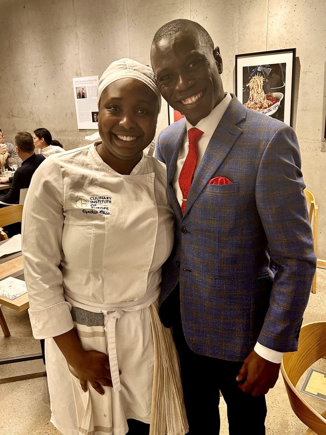 Cynthia in her Culinary Institute of Europe chef jacket with Aese